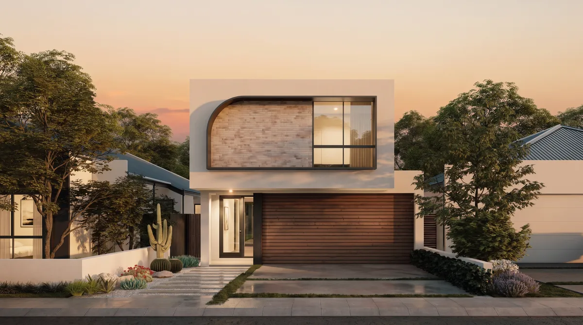 The same home at golden hour — warm amber sky, windows lit warm, the porch light on