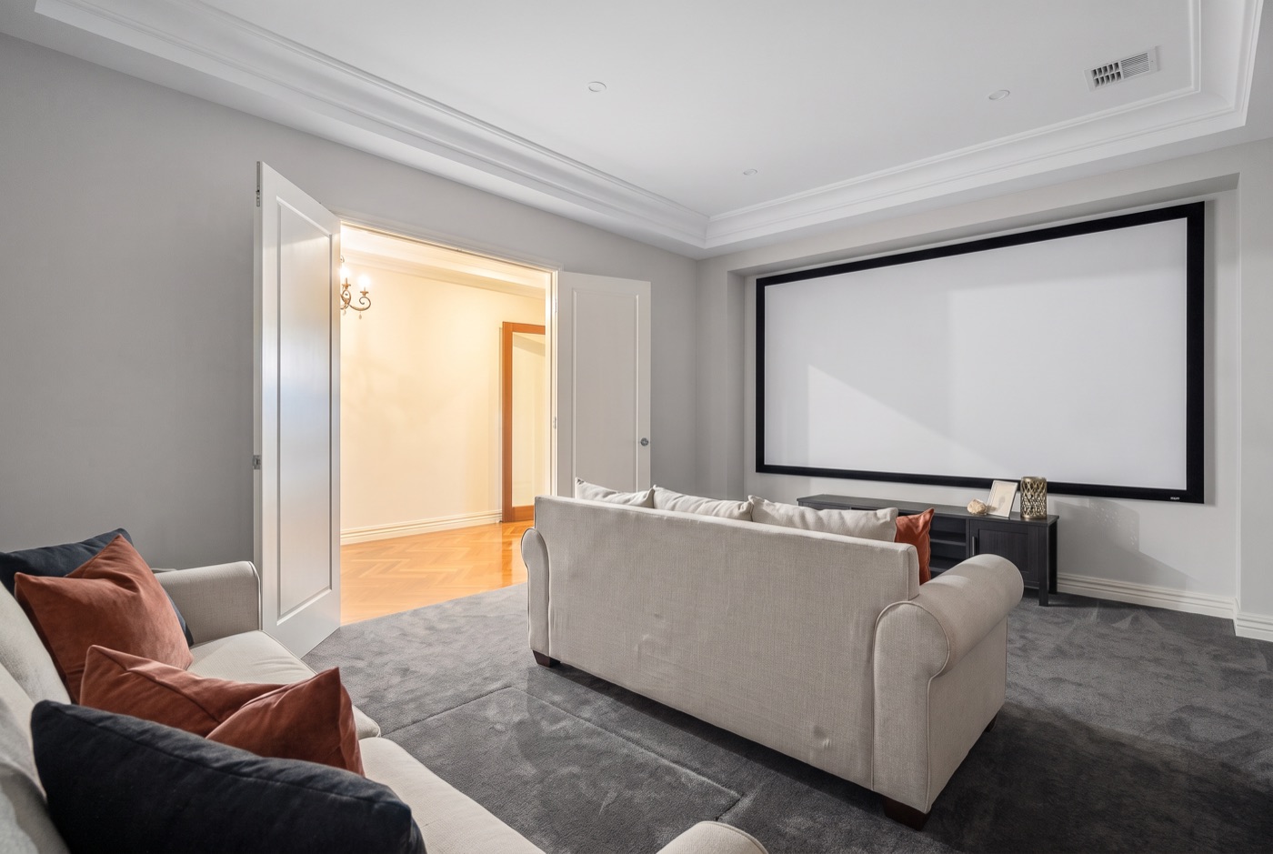 The three captured frames merged into one finished home-theatre photo